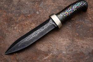 Unique custom made dagger with intricate patterns photo