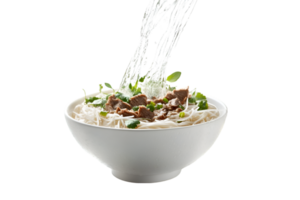 Pho noodle soup with beef and fresh herbs being poured with broth on a transparent background png
