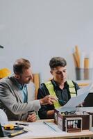 Team Engineers with draft plan of building on constructing site. Engineer work on site. engineer visit and inspection site engineer. Inspector engineer check and working on site. photo