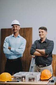 Team Engineers with draft plan of building on constructing site. Engineer work on site. engineer visit and inspection site engineer. Inspector engineer check and working on site. photo