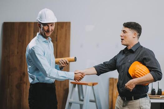 Team Engineers with draft plan of building on constructing site. Engineer work on site. engineer visit and inspection site engineer. Inspector engineer check and working on site. photo