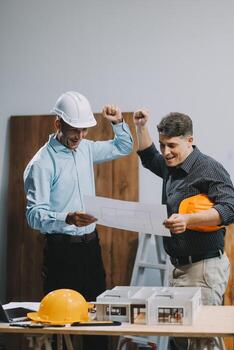 Team Engineers with draft plan of building on constructing site. Engineer work on site. engineer visit and inspection site engineer. Inspector engineer check and working on site. photo