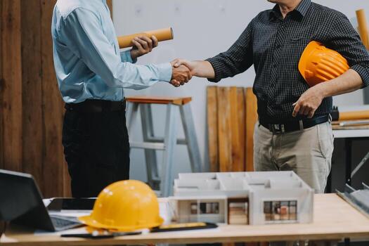 Team Engineers with draft plan of building on constructing site. Engineer work on site. engineer visit and inspection site engineer. Inspector engineer check and working on site. photo