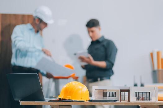 Team Engineers with draft plan of building on constructing site. Engineer work on site. engineer visit and inspection site engineer. Inspector engineer check and working on site. photo