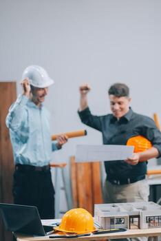 Team Engineers with draft plan of building on constructing site. Engineer work on site. engineer visit and inspection site engineer. Inspector engineer check and working on site. photo