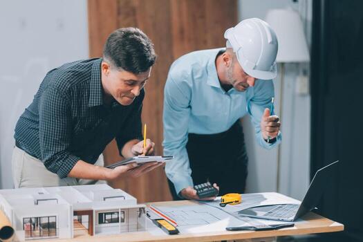 Team Engineers with draft plan of building on constructing site. Engineer work on site. engineer visit and inspection site engineer. Inspector engineer check and working on site. photo