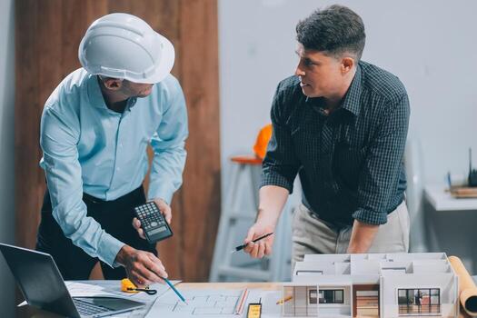 Team Engineers with draft plan of building on constructing site. Engineer work on site. engineer visit and inspection site engineer. Inspector engineer check and working on site. photo