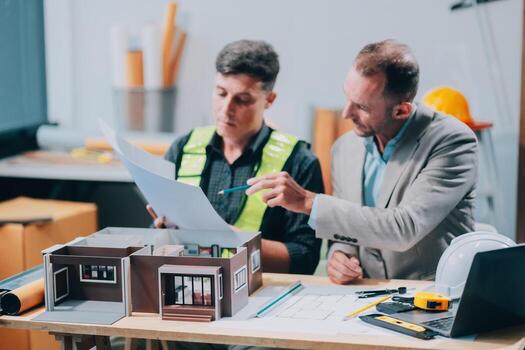 Team Engineers with draft plan of building on constructing site. Engineer work on site. engineer visit and inspection site engineer. Inspector engineer check and working on site. photo