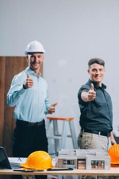 Team Engineers with draft plan of building on constructing site. Engineer work on site. engineer visit and inspection site engineer. Inspector engineer check and working on site. photo