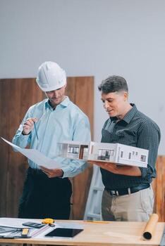 Team Engineers with draft plan of building on constructing site. Engineer work on site. engineer visit and inspection site engineer. Inspector engineer check and working on site. photo