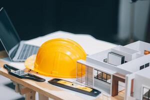 Team Engineers with draft plan of building on constructing site. Engineer work on site. engineer visit and inspection site engineer. Inspector engineer check and working on site. photo