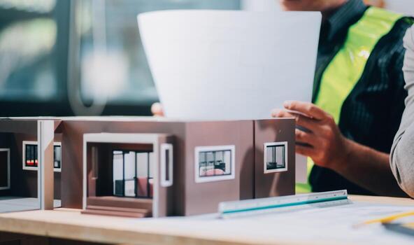 Team Engineers with draft plan of building on constructing site. Engineer work on site. engineer visit and inspection site engineer. Inspector engineer check and working on site. photo