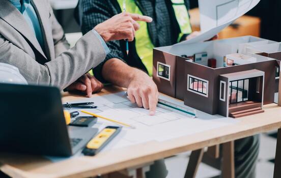 Team Engineers with draft plan of building on constructing site. Engineer work on site. engineer visit and inspection site engineer. Inspector engineer check and working on site. photo