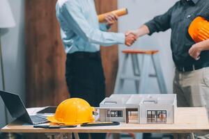 Team Engineers with draft plan of building on constructing site. Engineer work on site. engineer visit and inspection site engineer. Inspector engineer check and working on site. photo