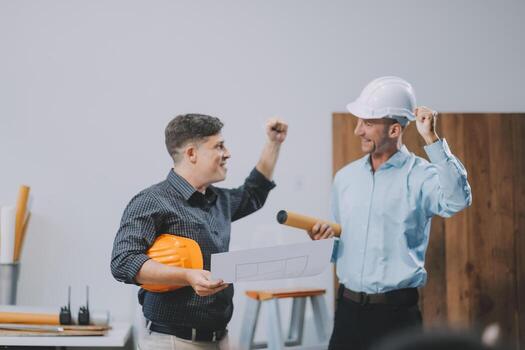 Team Engineers with draft plan of building on constructing site. Engineer work on site. engineer visit and inspection site engineer. Inspector engineer check and working on site. photo