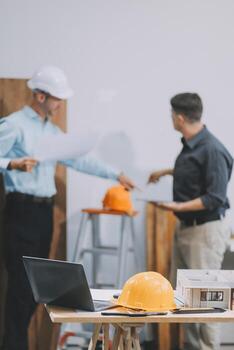 Team Engineers with draft plan of building on constructing site. Engineer work on site. engineer visit and inspection site engineer. Inspector engineer check and working on site. photo