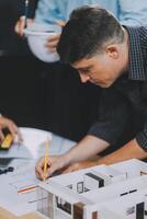 Team Engineers with draft plan of building on constructing site. Engineer work on site. engineer visit and inspection site engineer. Inspector engineer check and working on site. photo