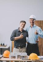 Team Engineers with draft plan of building on constructing site. Engineer work on site. engineer visit and inspection site engineer. Inspector engineer check and working on site. photo
