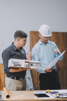 Team Engineers with draft plan of building on constructing site. Engineer work on site. engineer visit and inspection site engineer. Inspector engineer check and working on site. photo