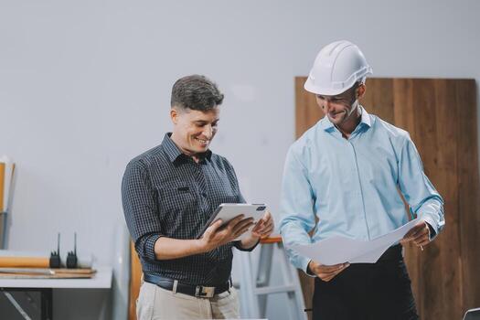 Team Engineers with draft plan of building on constructing site. Engineer work on site. engineer visit and inspection site engineer. Inspector engineer check and working on site. photo