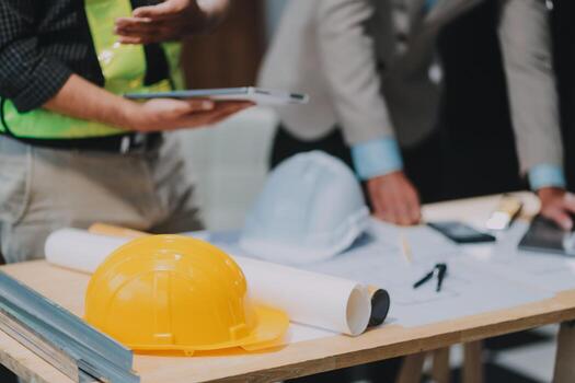 Team Engineers with draft plan of building on constructing site. Engineer work on site. engineer visit and inspection site engineer. Inspector engineer check and working on site. photo