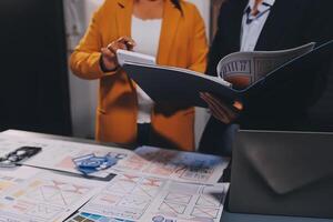 The designer team is designing the uxui system to make the uxui system work well on new phones and support system updates. Website development concept UI UX front end designer photo