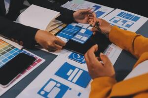 The designer team is designing the uxui system to make the uxui system work well on new phones and support system updates. Website development concept UI UX front end designer photo