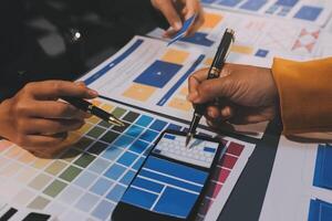 The designer team is designing the uxui system to make the uxui system work well on new phones and support system updates. Website development concept UI UX front end designer photo