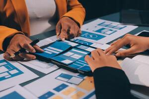 The designer team is designing the uxui system to make the uxui system work well on new phones and support system updates. Website development concept UI UX front end designer photo
