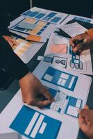The designer team is designing the uxui system to make the uxui system work well on new phones and support system updates. Website development concept UI UX front end designer photo