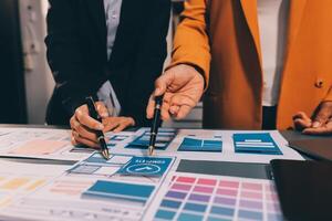 The designer team is designing the uxui system to make the uxui system work well on new phones and support system updates. Website development concept UI UX front end designer photo
