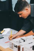 Team Engineers with draft plan of building on constructing site. Engineer work on site. engineer visit and inspection site engineer. Inspector engineer check and working on site. photo
