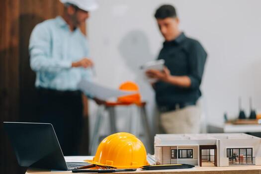 Team Engineers with draft plan of building on constructing site. Engineer work on site. engineer visit and inspection site engineer. Inspector engineer check and working on site. photo