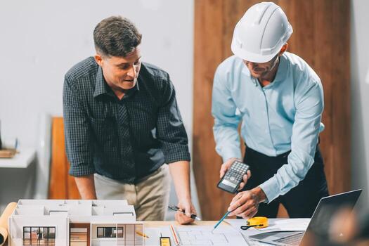 Team Engineers with draft plan of building on constructing site. Engineer work on site. engineer visit and inspection site engineer. Inspector engineer check and working on site. photo