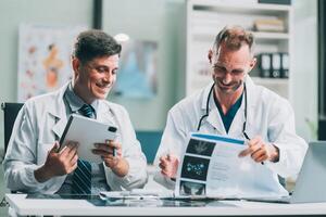 Group of medical practitioners working together and analyzing medical scan in the hospital photo