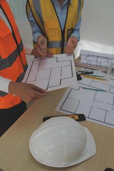 Construction and structure concept of Engineer or architect meeting for project working with partner and engineering tools on model building and blueprint in working site, contract for both companies. photo