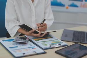 Business Documents, Auditor businesswoman checking searching document legal prepare paperwork or report for analysis TAX time,accountant Documents data contract partner deal in workplace office photo
