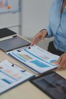 Business Documents, Auditor businesswoman checking searching document legal prepare paperwork or report for analysis TAX time,accountant Documents data contract partner deal in workplace office photo