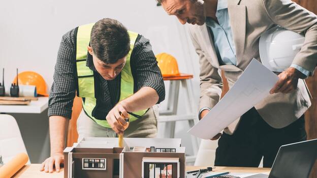Team Engineers with draft plan of building on constructing site. Engineer work on site. engineer visit and inspection site engineer. Inspector engineer check and working on site. photo