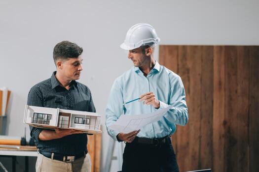 Team Engineers with draft plan of building on constructing site. Engineer work on site. engineer visit and inspection site engineer. Inspector engineer check and working on site. photo