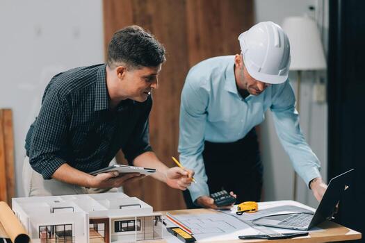 Team Engineers with draft plan of building on constructing site. Engineer work on site. engineer visit and inspection site engineer. Inspector engineer check and working on site. photo