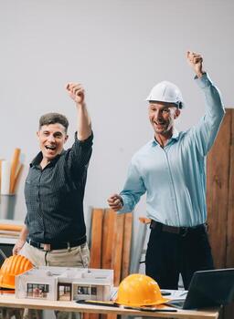 Team Engineers with draft plan of building on constructing site. Engineer work on site. engineer visit and inspection site engineer. Inspector engineer check and working on site. photo