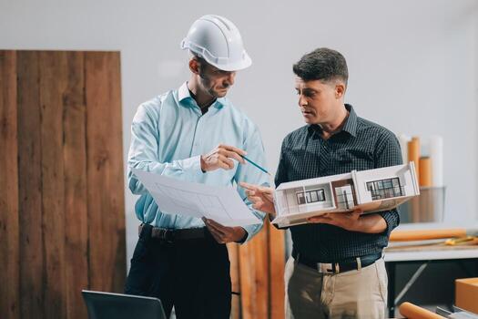 Team Engineers with draft plan of building on constructing site. Engineer work on site. engineer visit and inspection site engineer. Inspector engineer check and working on site. photo