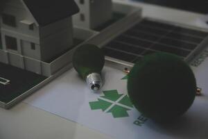 Green energy business company meeting with business people planning and discuss marketing of sustainable and renewable clean energy product with solar cell and wind turbine generator. Trailblazing photo