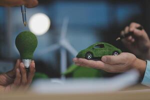 Green energy business company meeting with business people planning and discuss marketing of sustainable and renewable clean energy product with solar cell and wind turbine generator. Trailblazing photo