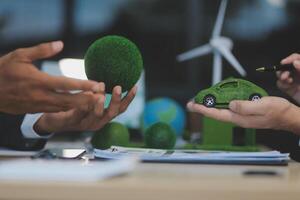 Green energy business company meeting with business people planning and discuss marketing of sustainable and renewable clean energy product with solar cell and wind turbine generator. Trailblazing photo