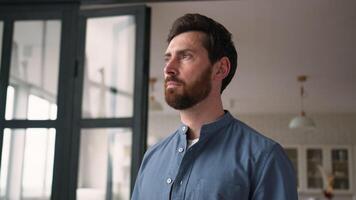 Thoughtful Caucasian man bearded guy middle-aged dad pondering at home. Pensive parent contemplating adult male father thinking with serious facial expression confident businessman feel calm dreaming video