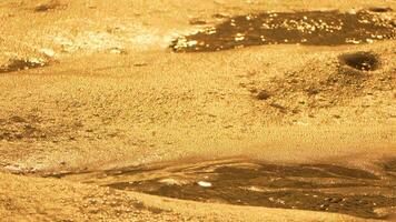 Cave Wall Texture Gold Rock - A close-up of a gold-colored cave wall with a textured surface. video