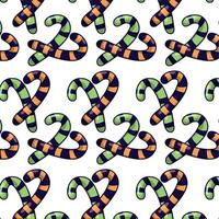 Halloween candy cane pattern in orange and green vector
