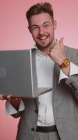 Business man shouting, raising fists, celebrating success, winning lottery jackpot, goal achievement photo